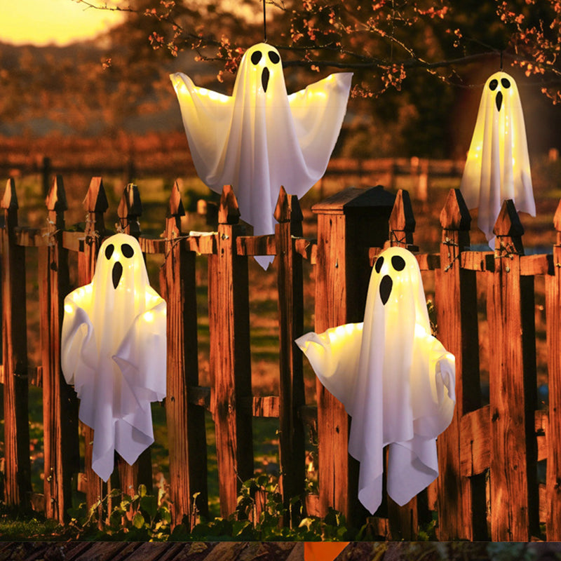Hanging Halloween ghosts on garden fence