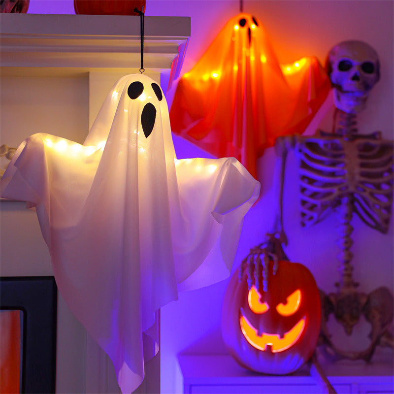 White and orange glowing Halloween ghosts